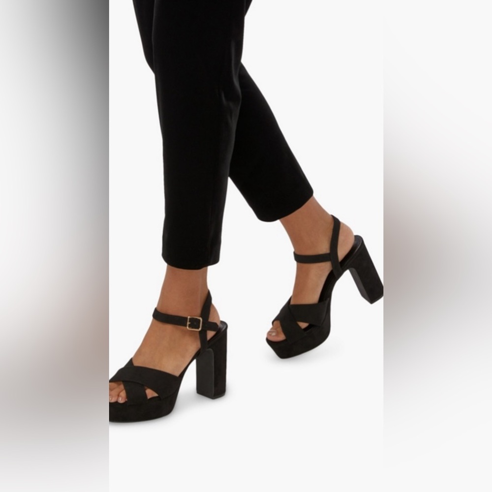 Black crossover platform sandal.